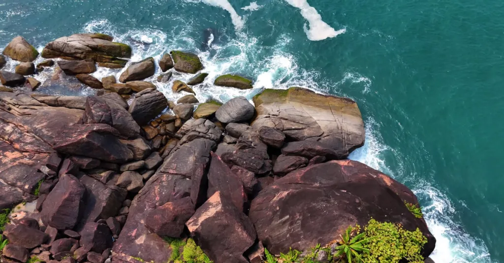Hidden cove of Butterfly Beach accessed through forest trail in South Goa