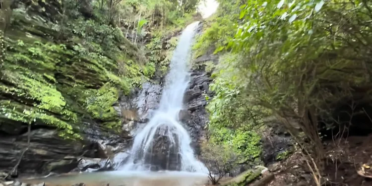 Pali Waterfall Goa with sacred natural Shivling formation during monsoon season,
