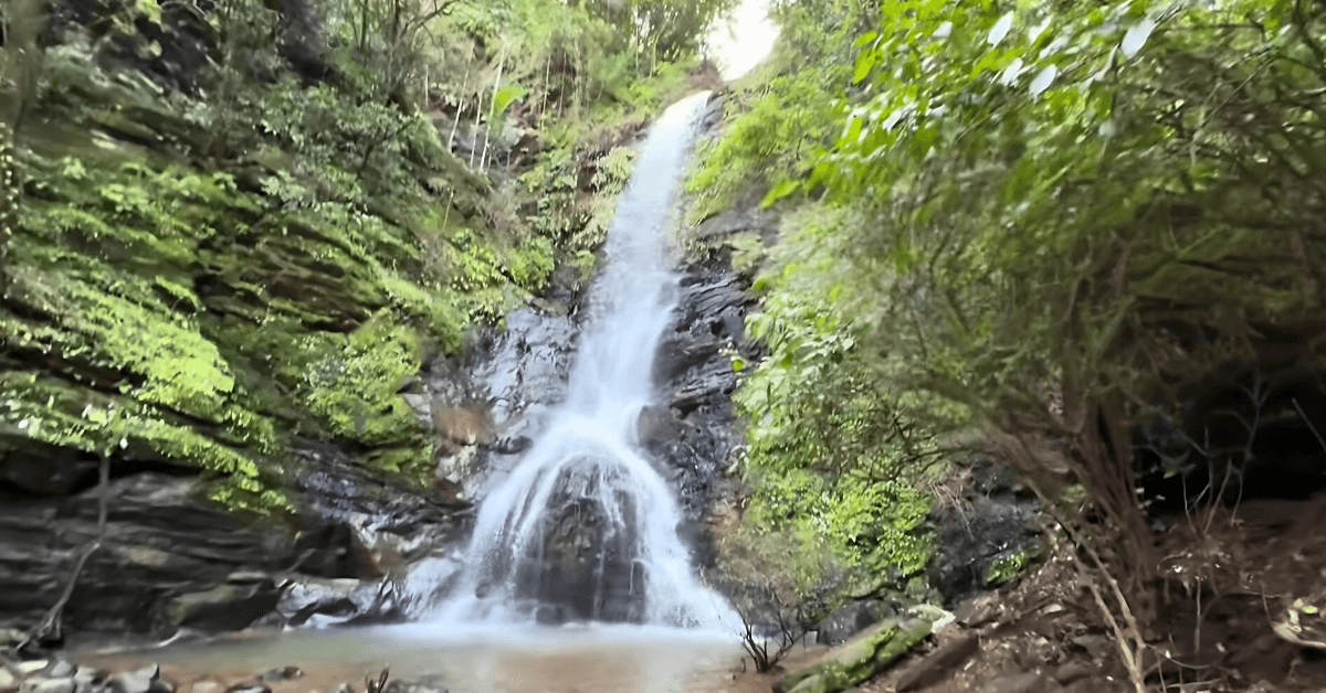 Pali Waterfall Goa with sacred natural Shivling formation during monsoon season,